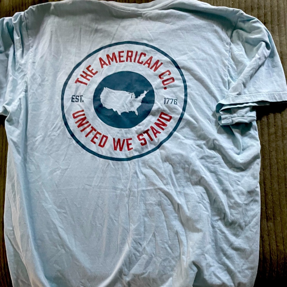 light blue aftico with dark blue usa on the back